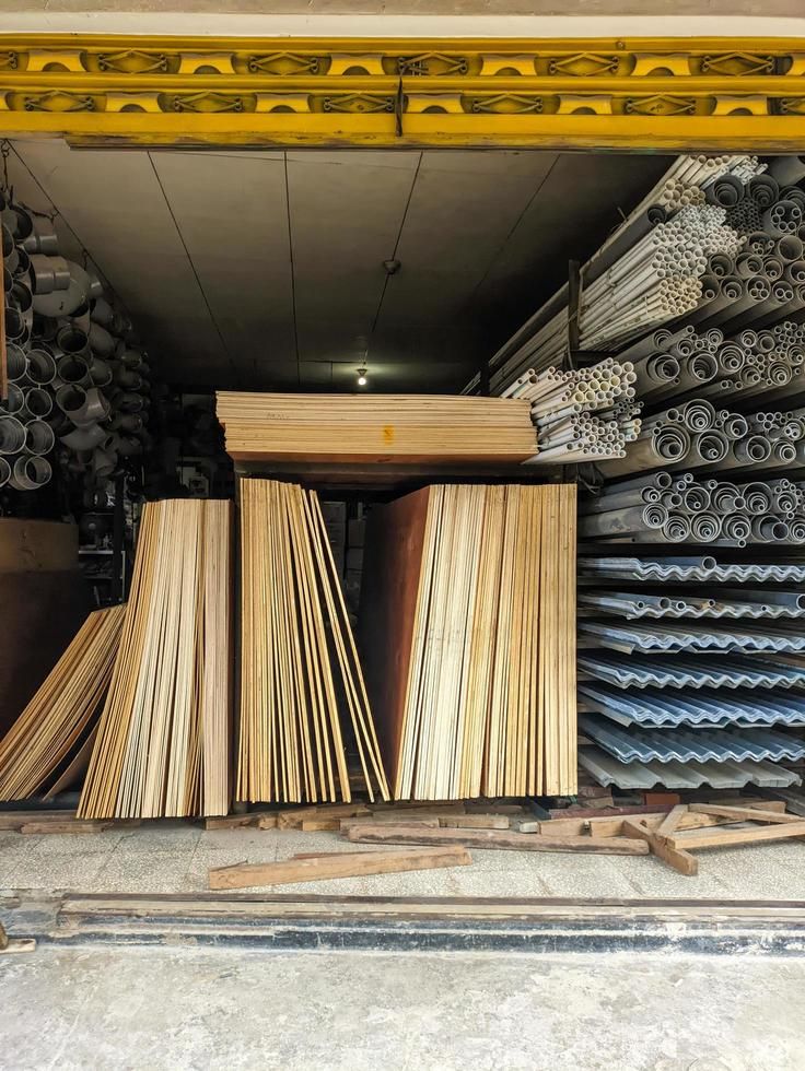 Building materials store stocked with timber boards, PVC pipes and roofing sheets